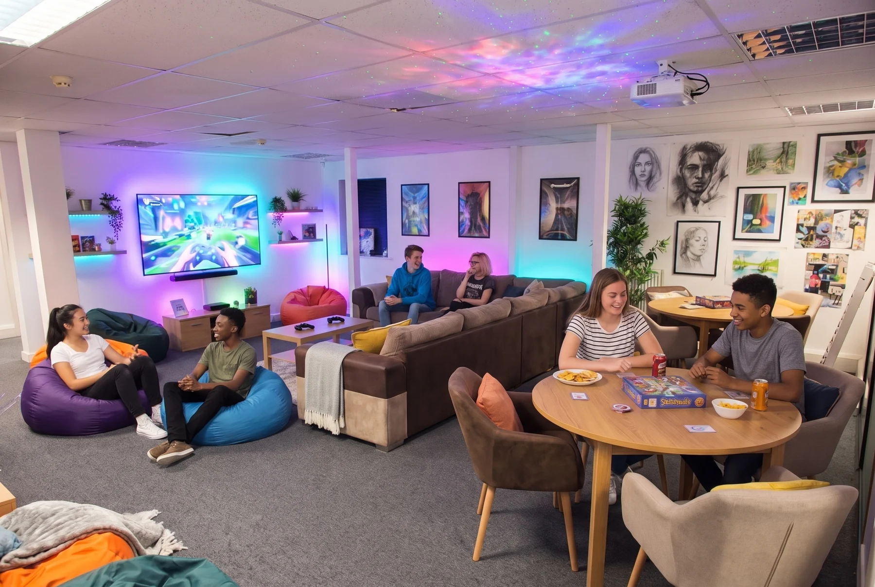The relaxed pathways social space with bean bags, soft seating, tables and a television